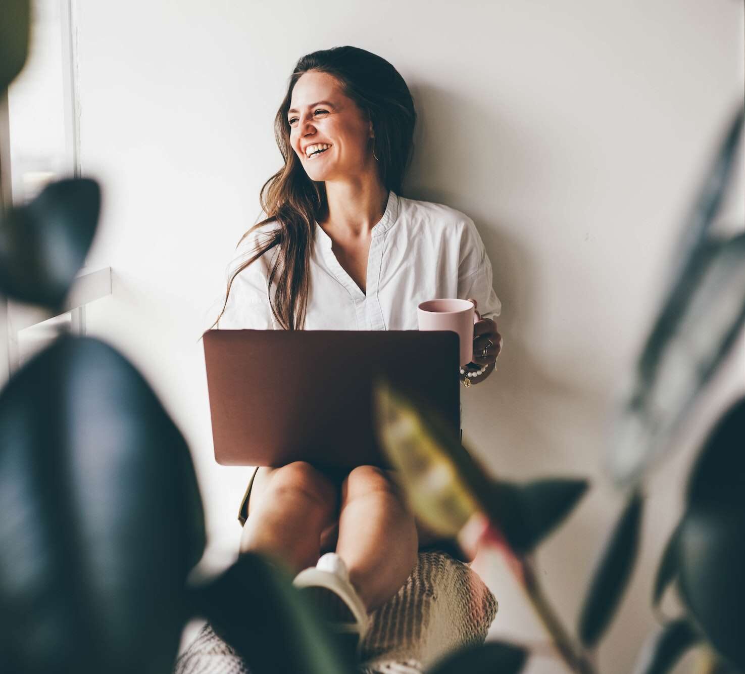 Businesswoman working at home. Freelancer and her workspace.